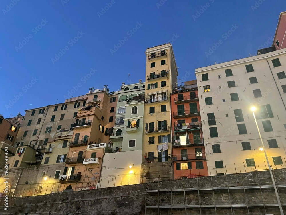 Colourful amazing facades of Italy buildings in the lake, river, sea and in the city center. Sunny day in Italy. Sightseeing in Milano, Genoa, Varenna, Bergamo, Lake Como.

