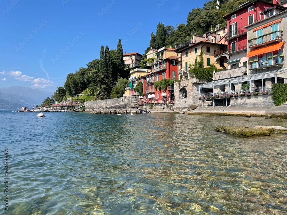 Colourful amazing facades of Italy buildings in the lake, river, sea and in the city center. Sunny day in Italy. Sightseeing in Milano, Genoa, Varenna, Bergamo, Lake Como.