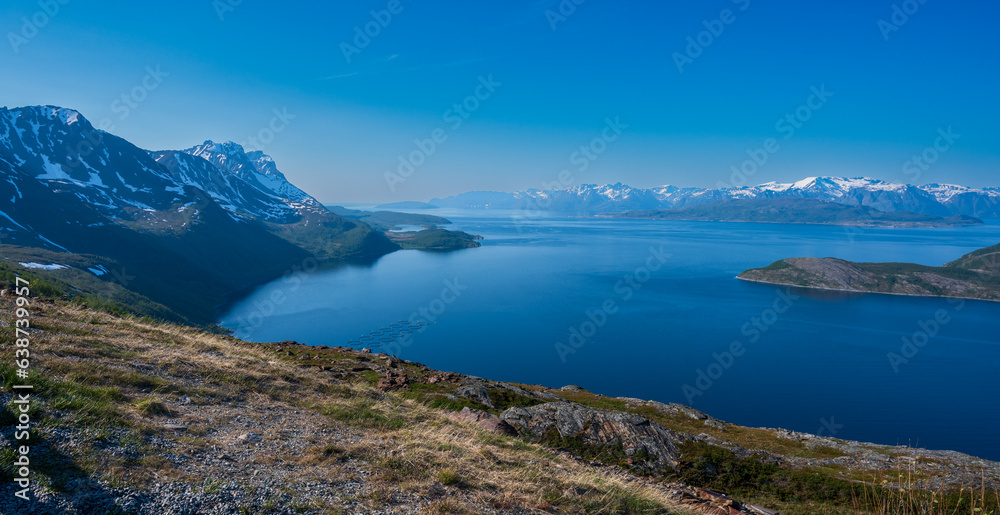Wonderful view of sea coast of fjord surrounded by high mountains.