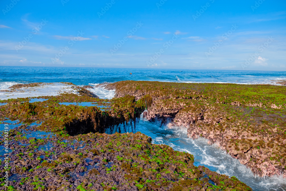 Sawarna beach,west Java,Indonesia, beautiful beach with coral reefs dotted with greenery 