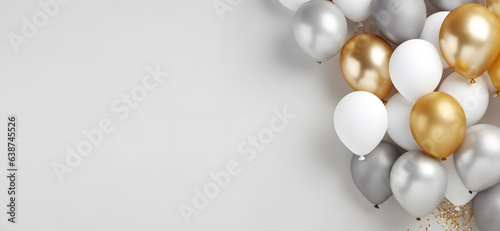 Silver and gold balloons isolated on light grey background
