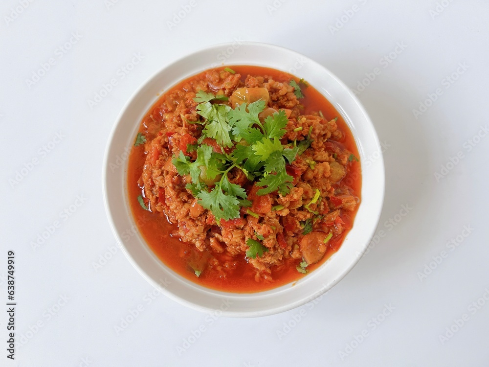 Nam Prik Ong, northern Thai food sauteed with ground pork, tomatoes and chili isolated on white background. Nam Prik Ong, northern Thai food sauteed with ground pork, tomatoes and chili isolated on white background.