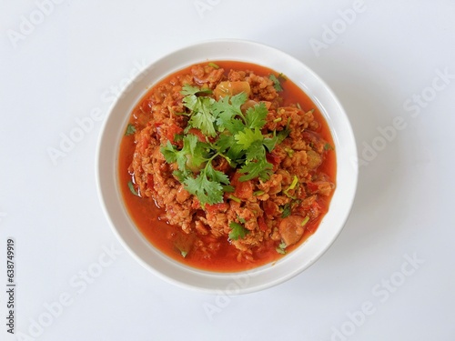Nam Prik Ong, northern Thai food sauteed with ground pork, tomatoes and chili isolated on white background.