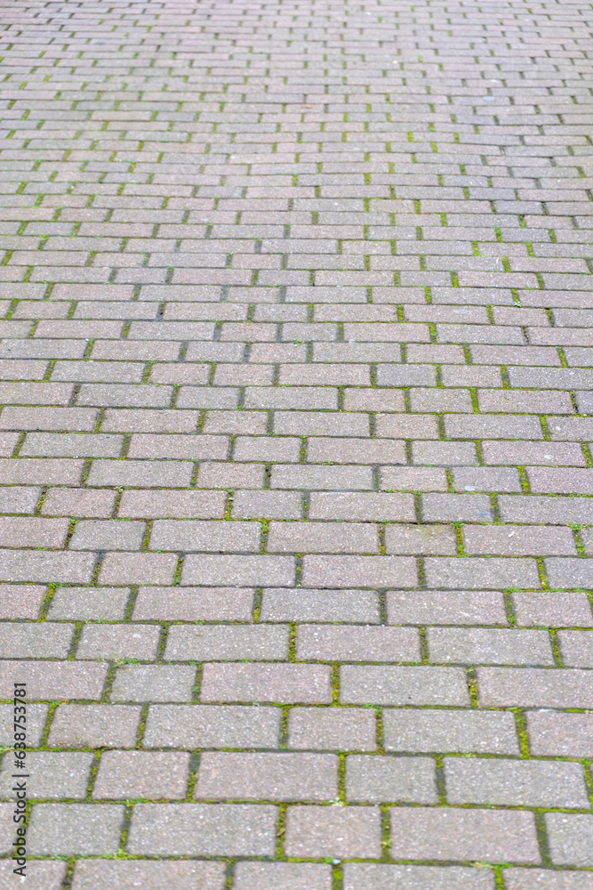 Stone paved floor background texture. Cobblestone grey footpath above view Stone paved floor background texture. Cobblestone grey footpath above view