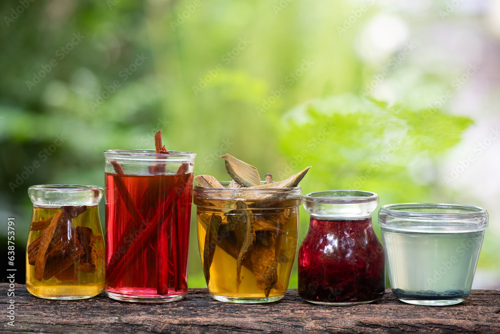 Colorful water dyes clothes extracted from herbs with water on nature background. Colorful water dyes clothes extracted from herbs with water on nature background.