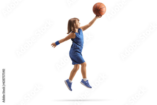 Little girl in a blue sports jersey shooting a layup