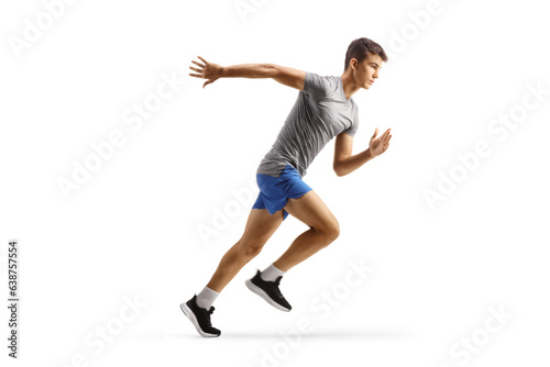 Full length profile shot of a fit male teenager running