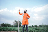Young Indian farmer standing at Agriculture field