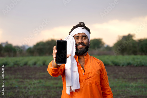 Young indian farmer in depression after see some detail in laptop.