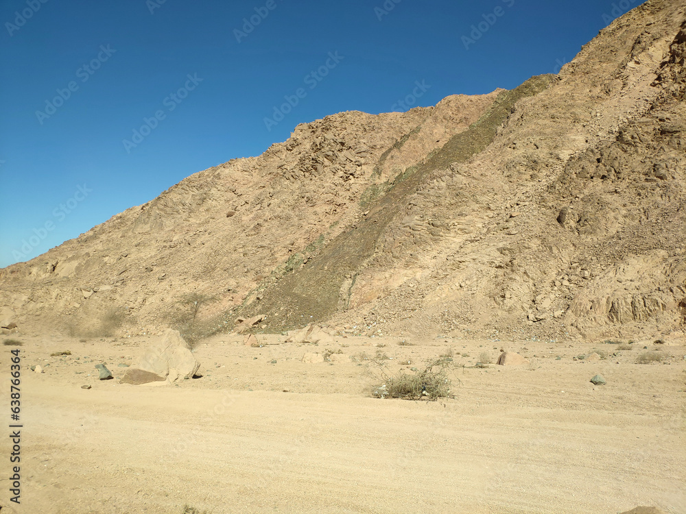 Desert land with mountains and sea