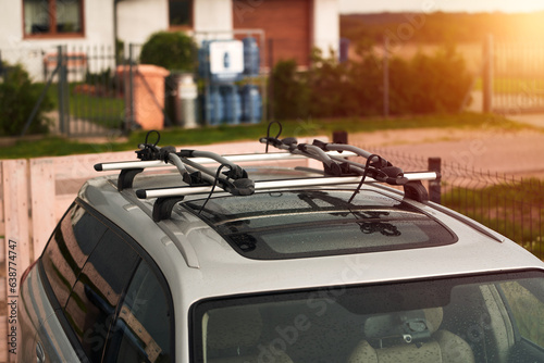 car is transporting bicycles on the roof. roof mount for carrying bikes and baggage. Family car for adventures