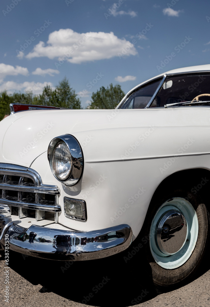 Headlights of white vintage car.