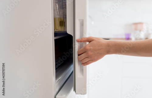 opening white refrigerator door