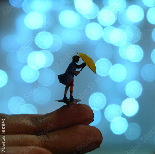 Miniature Woman with Umbrella in Romantic Scene