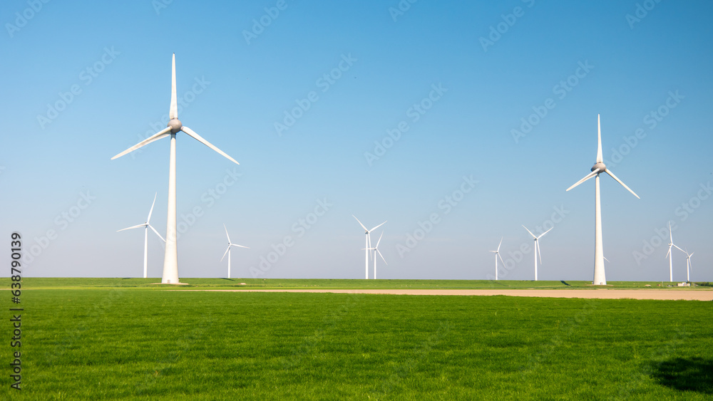 offshore windmill park and a blue sky, windmill park in the ocean aerial view with wind turbine Flevoland Netherlands Ijsselmeer. Green energy concept offshore windmill park and a blue sky, windmill park in the ocean aerial view with wind turbine Flevoland Netherlands Ijsselmeer. Green energy concept