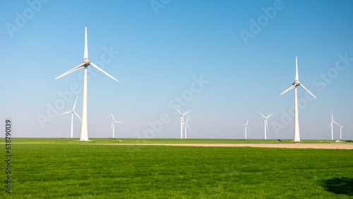 offshore windmill park and a blue sky, windmill park in the ocean aerial view with wind turbine Flevoland Netherlands Ijsselmeer. Green energy concept