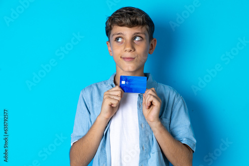 Photo of cheerful MODEL hold debit card look empty space