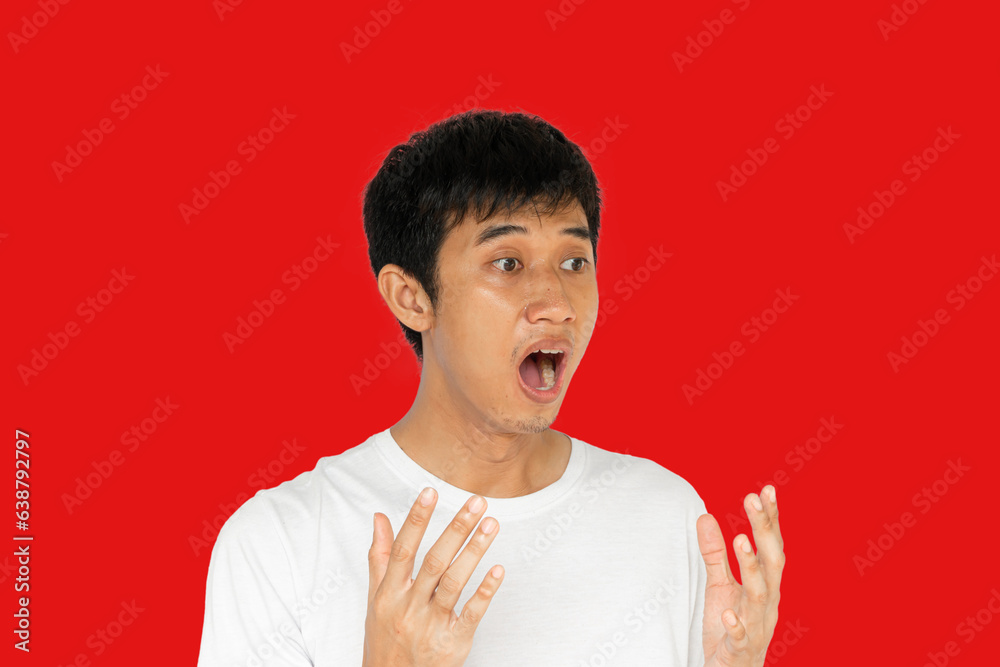 Young man isolated on red background with surprise facial expression Young man isolated on red background with surprise facial expression