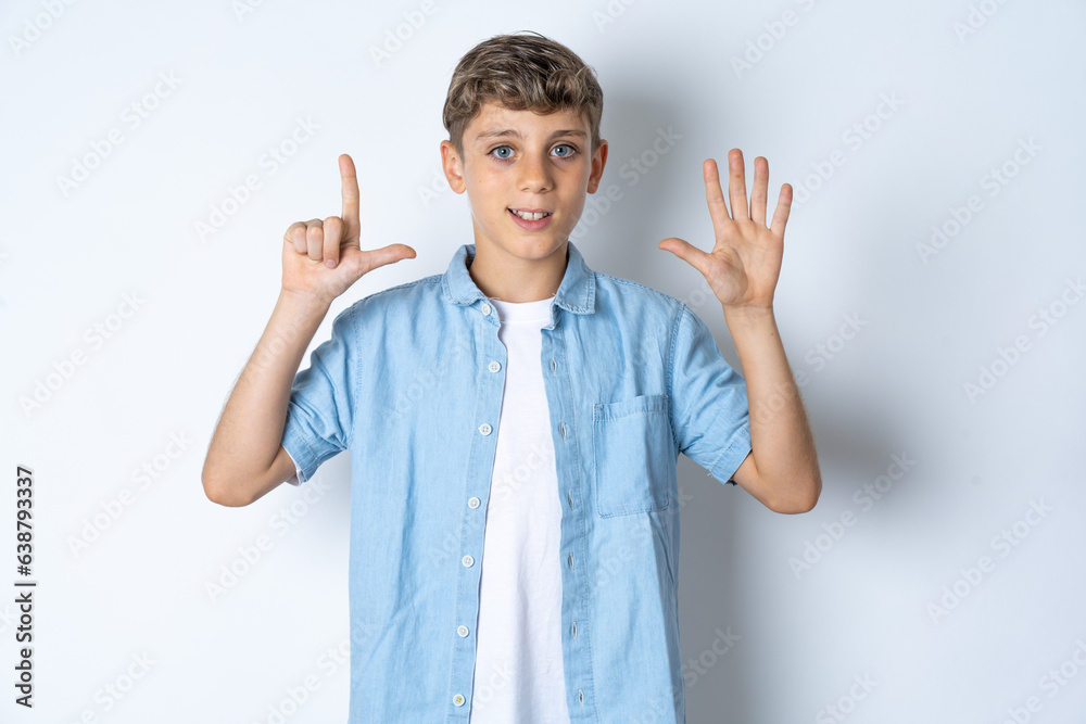 Beautiful kid boy wearing casual clothes showing and pointing up with fingers number seven while smiling confident and happy. Beautiful kid boy wearing casual clothes showing and pointing up with fingers number seven while smiling confident and happy.