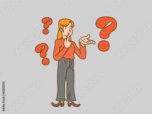Young business woman standing with question mark on a gray background.