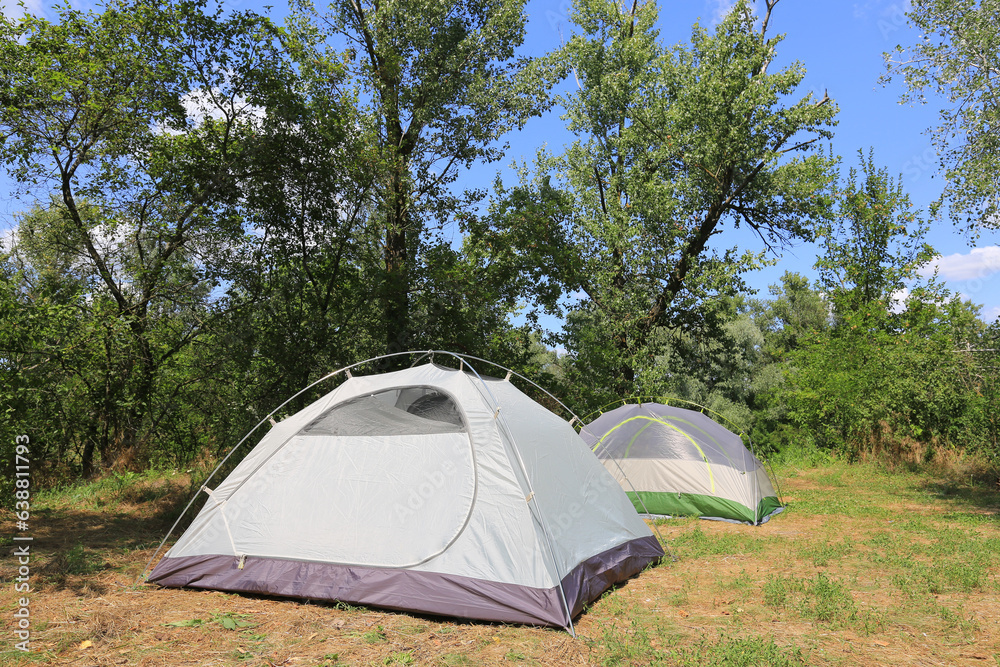 two tourist tents on meadow