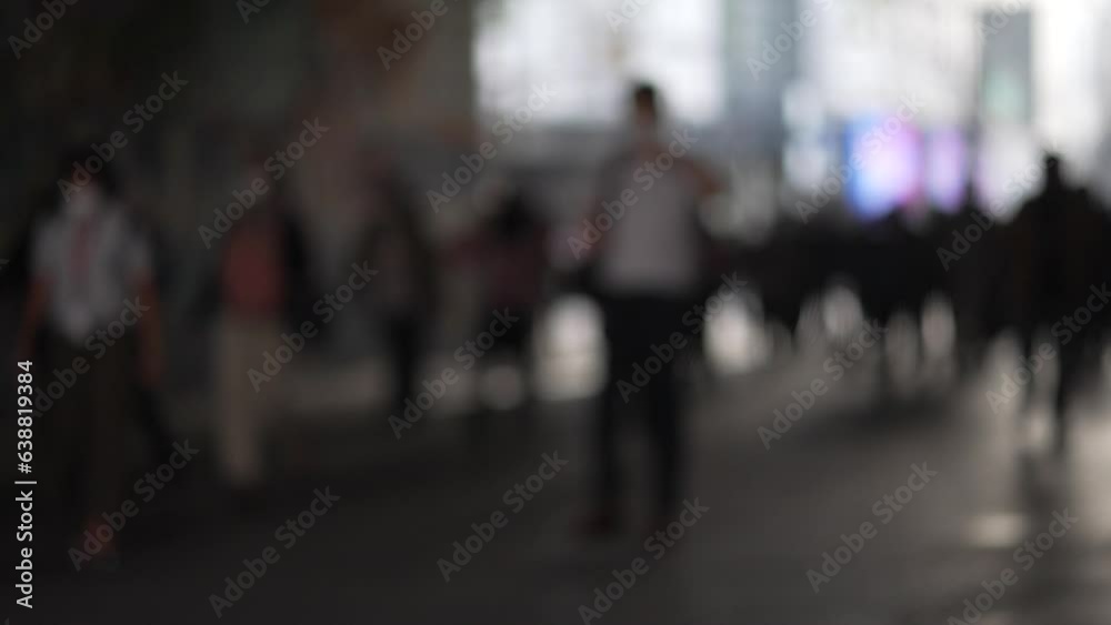 Blurred anonymous citizens of jakarta walking in a tunnel Blurred anonymous citizens of jakarta walking in a tunnel