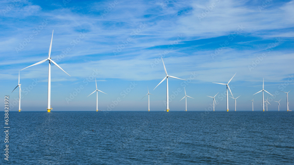 windmill park in the ocean aerial view with wind turbines in Flevoland Netherlands Ijsselmeer. Green energy 