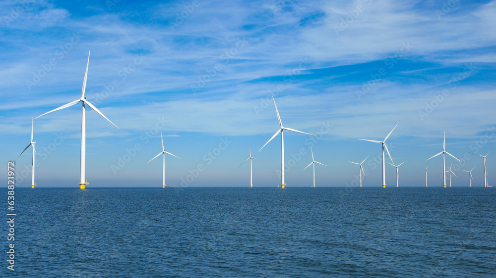 windmill park in the ocean aerial view with wind turbines in Flevoland Netherlands Ijsselmeer. Green energy windmill park in the ocean aerial view with wind turbines in Flevoland Netherlands Ijsselmeer. Green energy