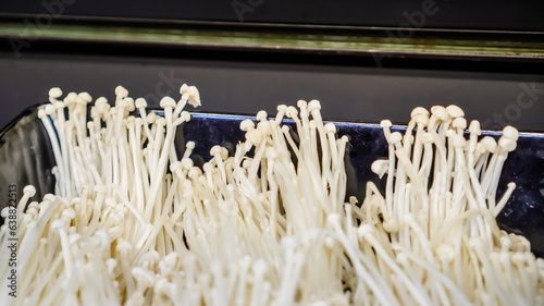 Beech mushrooms or White Enoki mushroom on display in supermarket or groceries.