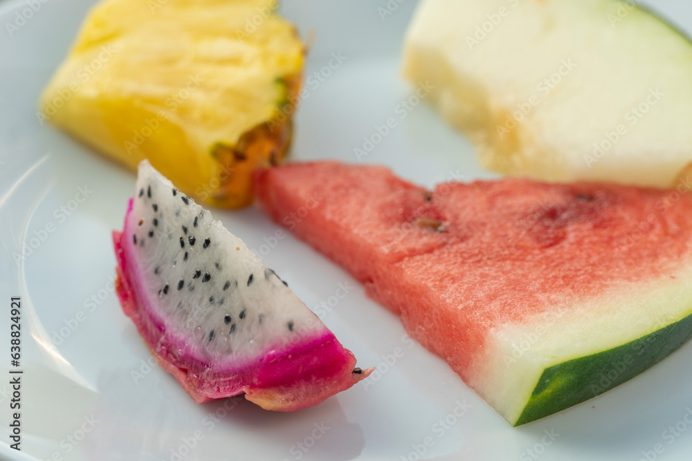 Plate of fresh fruit dragon fruit melon pineapple watermelon Plate of fresh fruit dragon fruit melon pineapple watermelon