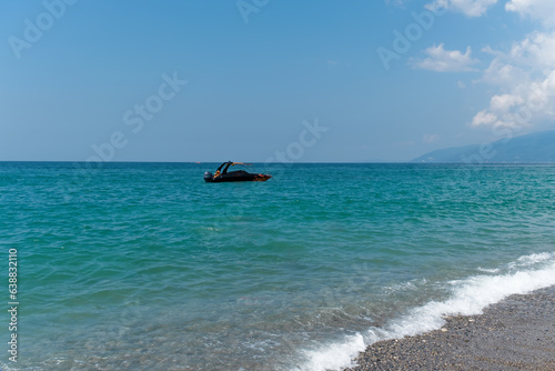 Amazing view of sea surface landscape at Gagra Abkhazia resort with blue sky as background. Calm waves and turquoise sea tranquility in paradise. Travel at vacation and tourism concept