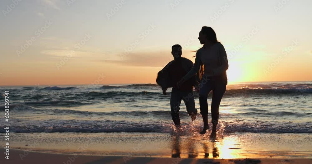 Holding hands, sunset and couple walking on a beach running on vacation or holiday together for love or care. Silhouette, man and woman with happiness on anniversary with travel freedom at ocean