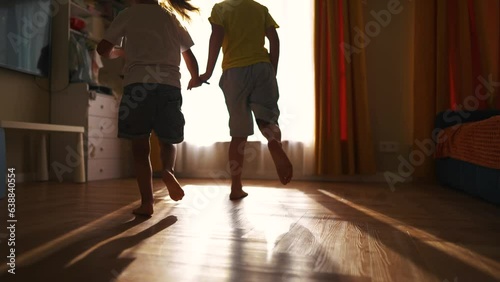 children run around the house barefoot. happy family childhood dream concept. a group of little kids running around the house and playing catch-up. children have fun bare feet lifestyle close up