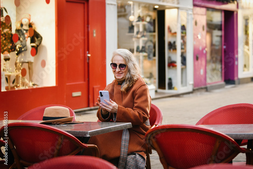 Blonde woman talking on video call and smile