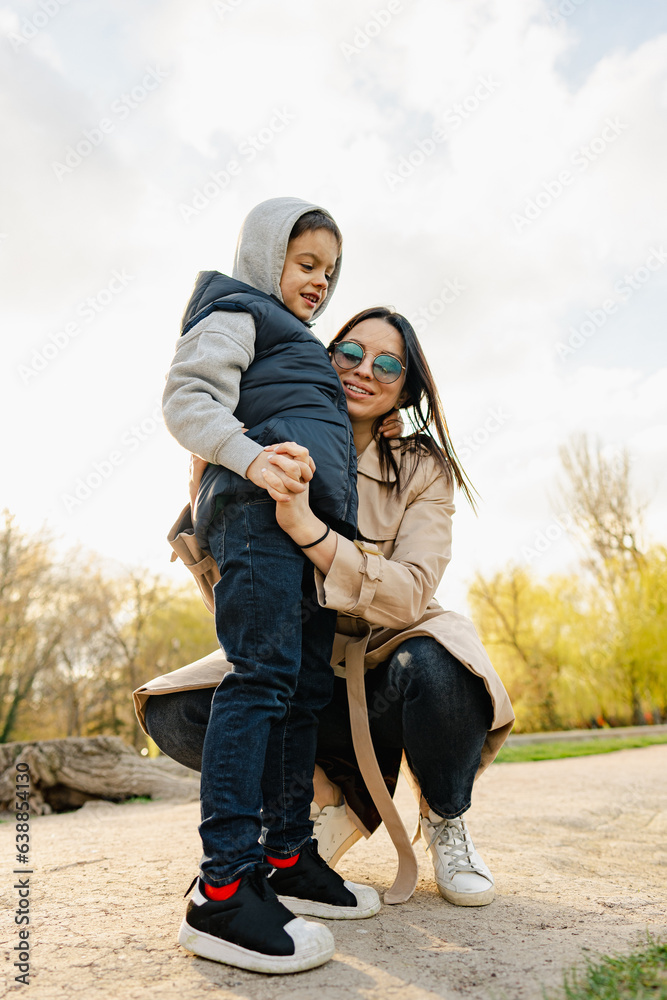 Single mother spending some time at the park with her little son Single mother spending some time at the park with her little son
