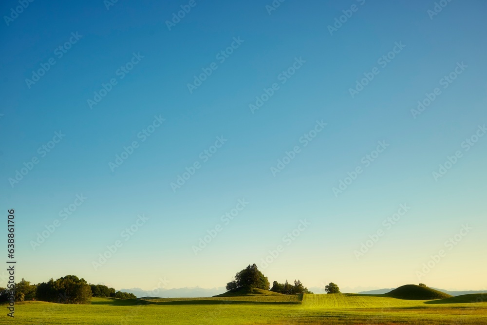 sunrise over the field with mountains in the background, southern bavaria, Germany