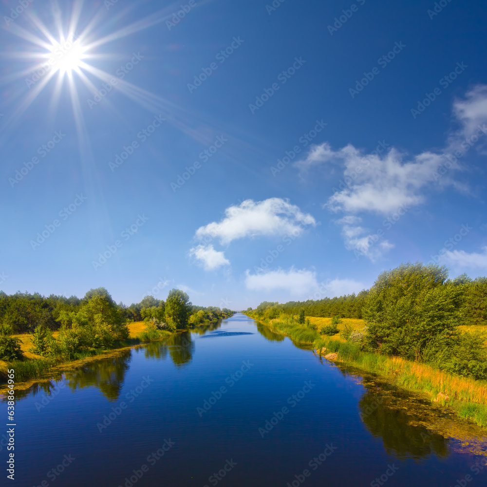 long calm irrigational channel at the summer sunny day long calm irrigational channel at the summer sunny day