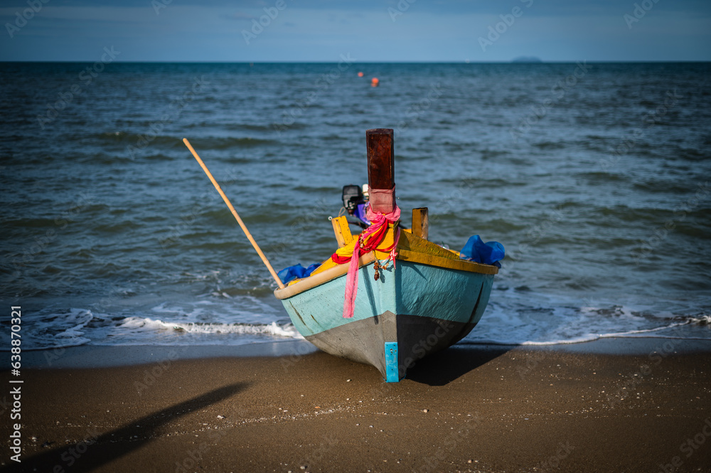 Small traditional fishing boats moored by the sea at Jomtien Beach, Pattaya, Thailand Small traditional fishing boats moored by the sea at Jomtien Beach, Pattaya, Thailand