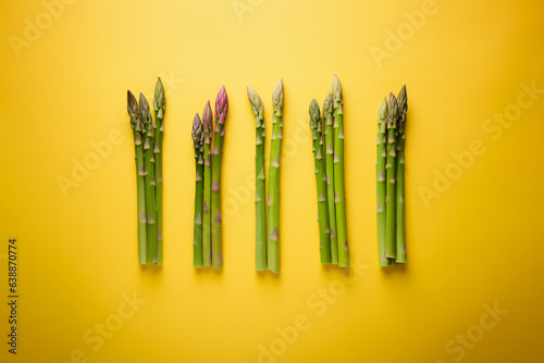 Asparagus on a solid color background. Isolated object in photo studio. Commercial shot with copyspace.