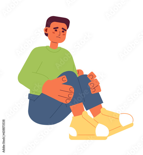 Sad hispanic boy semi flat color vector character. Scared young man sitting hugging knees. Editable full body person on white. Simple cartoon spot illustration for web graphic design