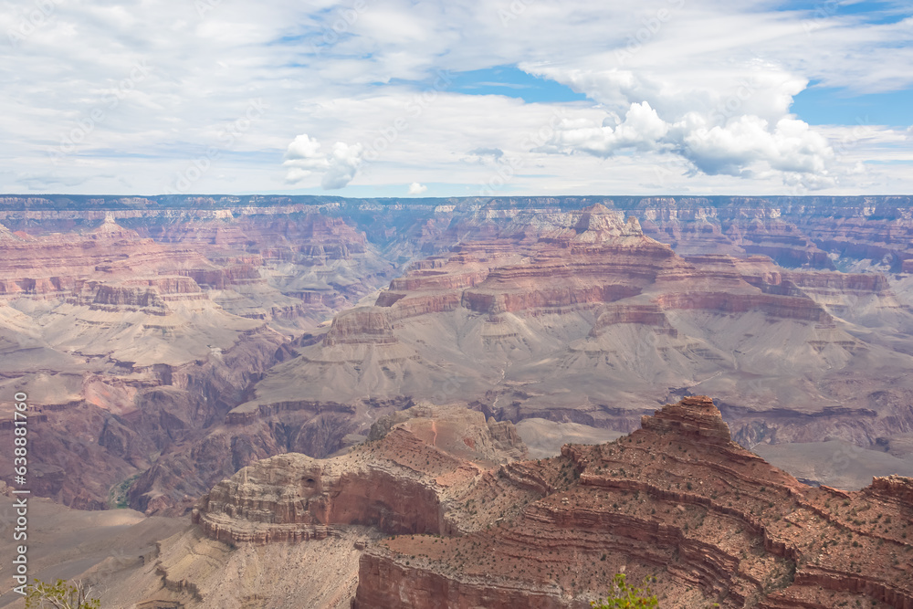 Panoramic aerial view from South Kaibab hiking trail at South Rim of Grand Canyon National Park, Arizona, USA, America. Colorado River weaving through valleys and rugged terrain. Natural world wonder