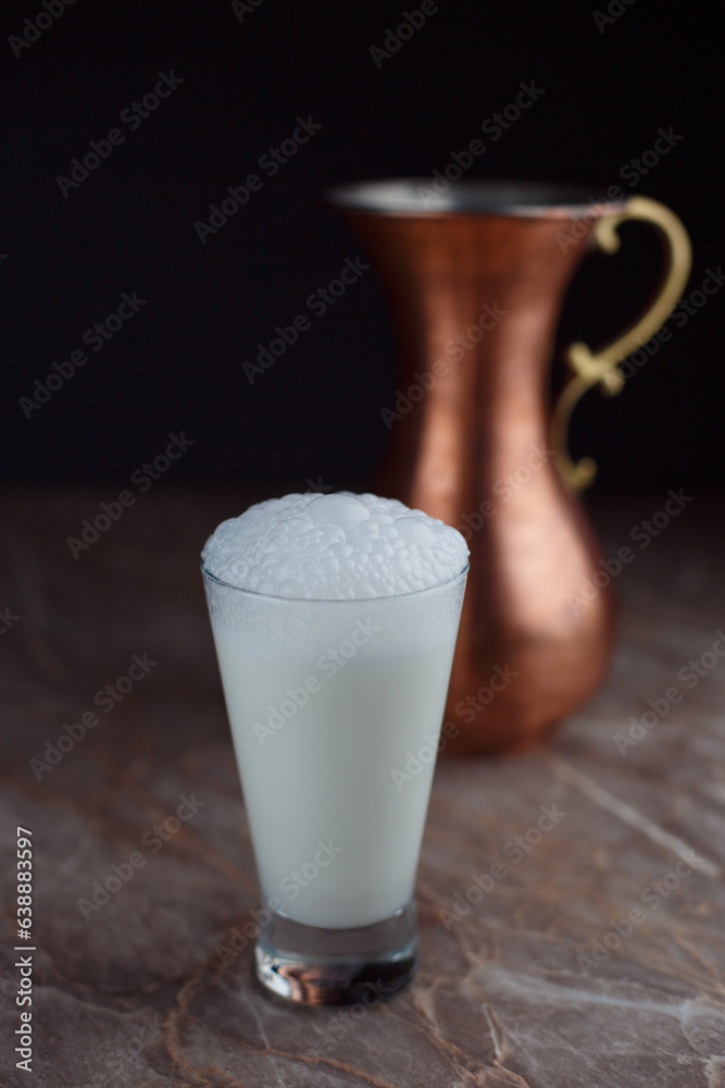 Special dairy buttermilk in a glass
isolated black background Special dairy buttermilk in a glass
isolated black background