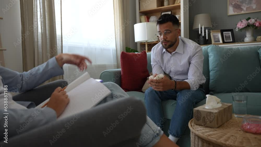 Business psychology. Female psychotherapist talks one on one with a male client who is a worker, company employee or small business owner, who is under stress and depression, without motivation Business psychology. Female psychotherapist talks one on one with a male client who is a worker, company employee or small business owner, who is under stress and depression, without motivation