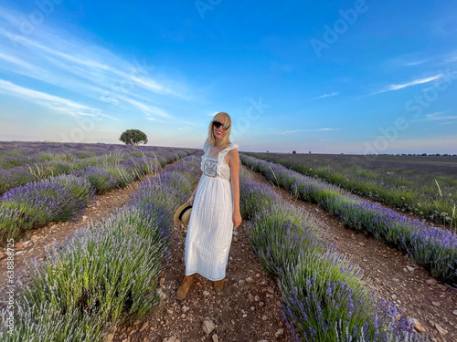 woman in a white dress in lavender fields