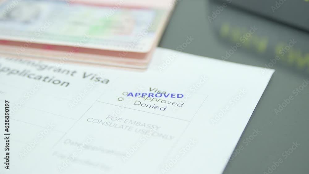 Close up visa application paper and stamp approved Close up visa application paper and stamp approved
