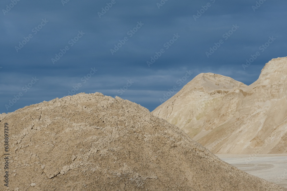 Sand hills on a blue sky background