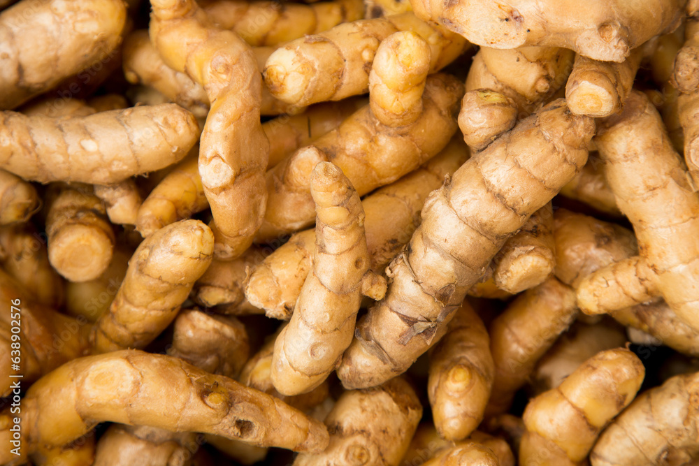 Turmeric ginger in a vegetable stand in Klong Toei Market in Bangkok. Turmeric ginger in a vegetable stand in Klong Toei Market in Bangkok.