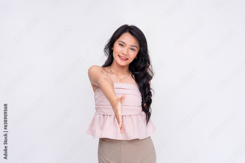 A friendly young asian woman offers a handshake. A lady befriending someone. Isolated on a white background. A friendly young asian woman offers a handshake. A lady befriending someone. Isolated on a white background.