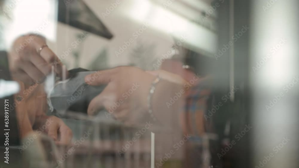 Unfocus snapshot of hand hold credit card pay products ordering use modern NFC technology, shop owner prepare card reader machine for customer to make payment transaction cashless contactless method