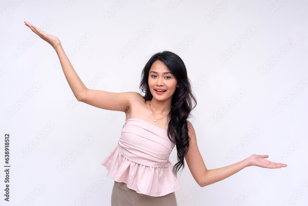 A pretty and vivacious young asian woman with hands stretched, presenting a topic or something with eagerness. Isolated on a white background. A pretty and vivacious young asian woman with hands stretched, presenting a topic or something with eagerness. Isolated on a white background.